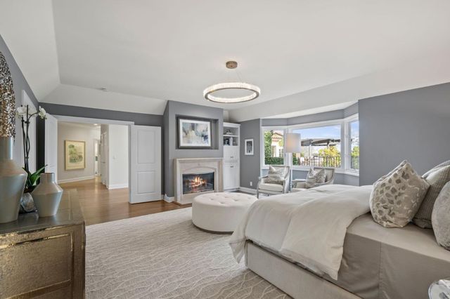 a bathroom with a toilet a sink and a large mirror