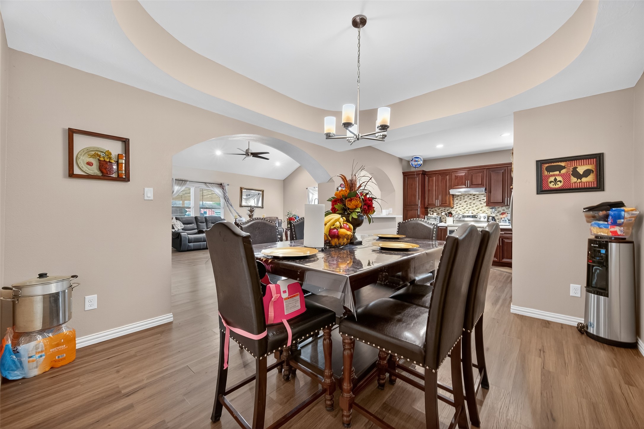 1619 Dolores Street Rosharon, TX 77583 - Photo 11 of 31 a view of a dining room with furniture wooden floor and chandelier
