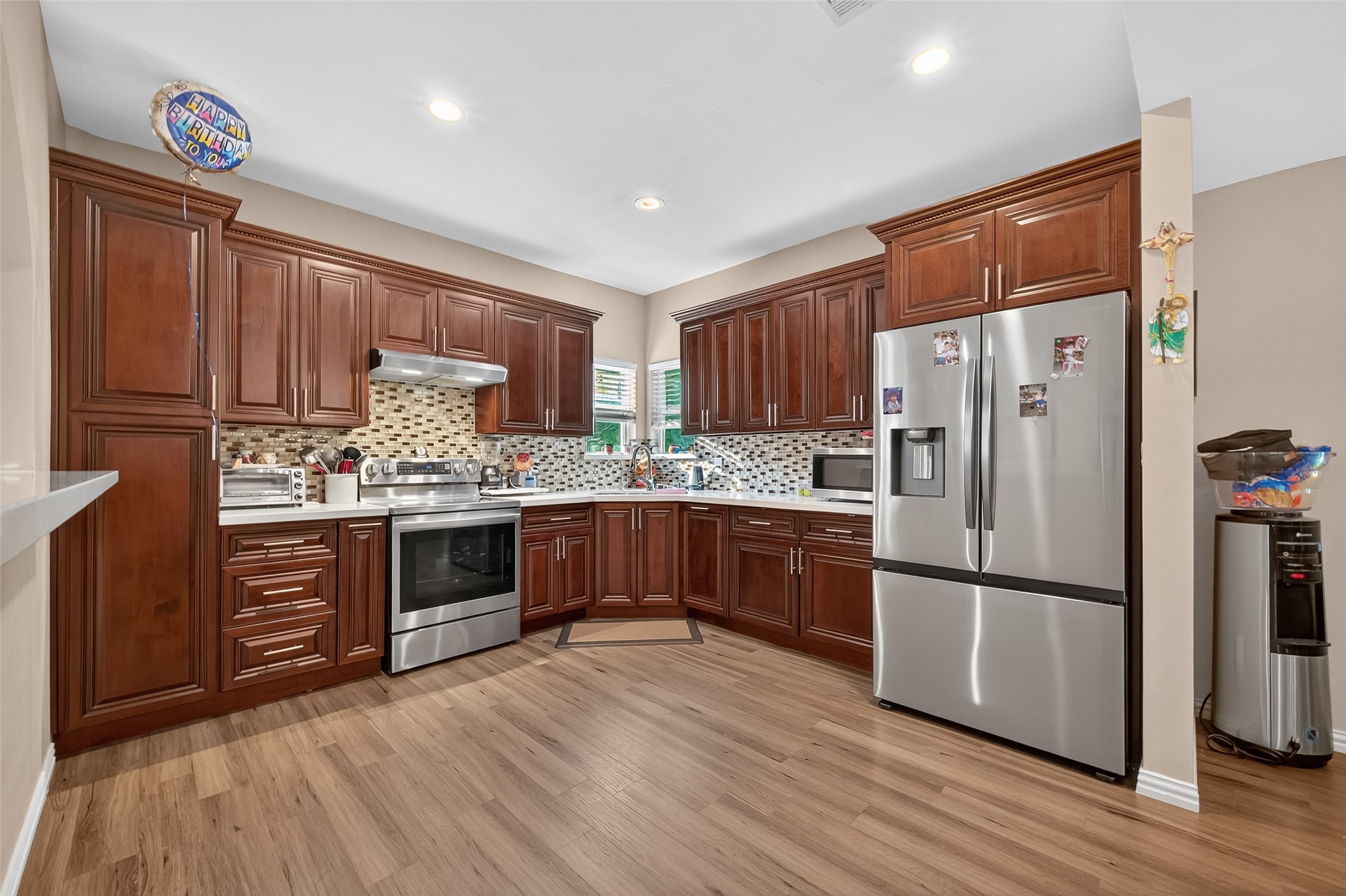 1619 Dolores Street Rosharon, TX 77583 - Photo 12 of 31 a kitchen with stainless steel appliances granite countertop a refrigerator stove and oven