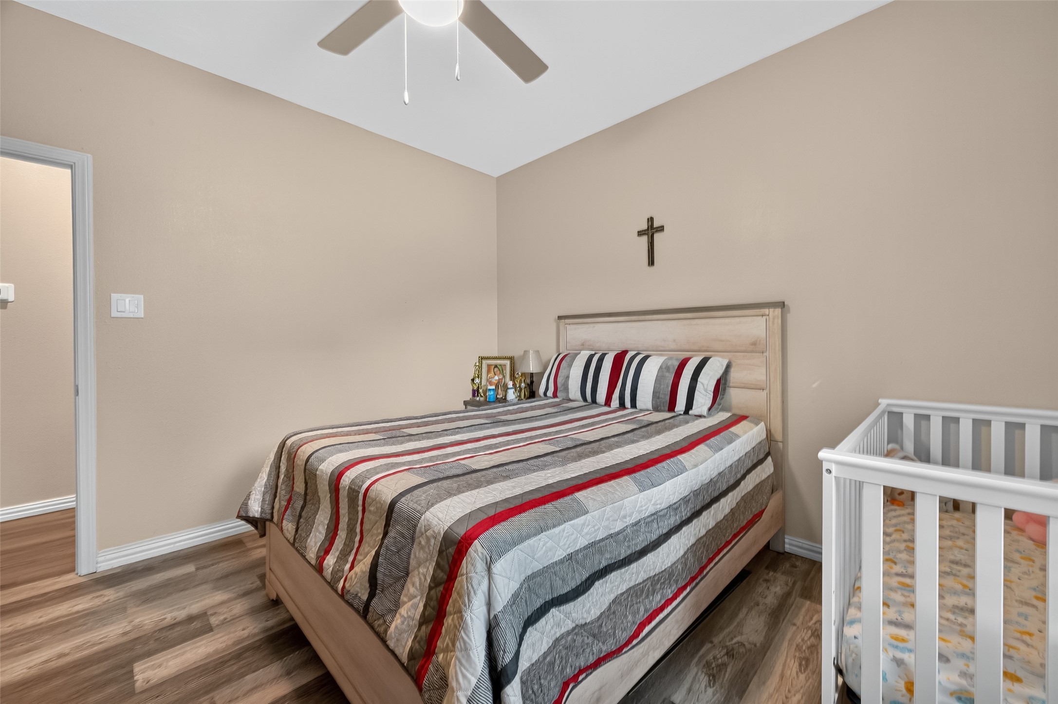 1619 Dolores Street Rosharon, TX 77583 - Photo 19 of 31 a bedroom with bed and a chandelier