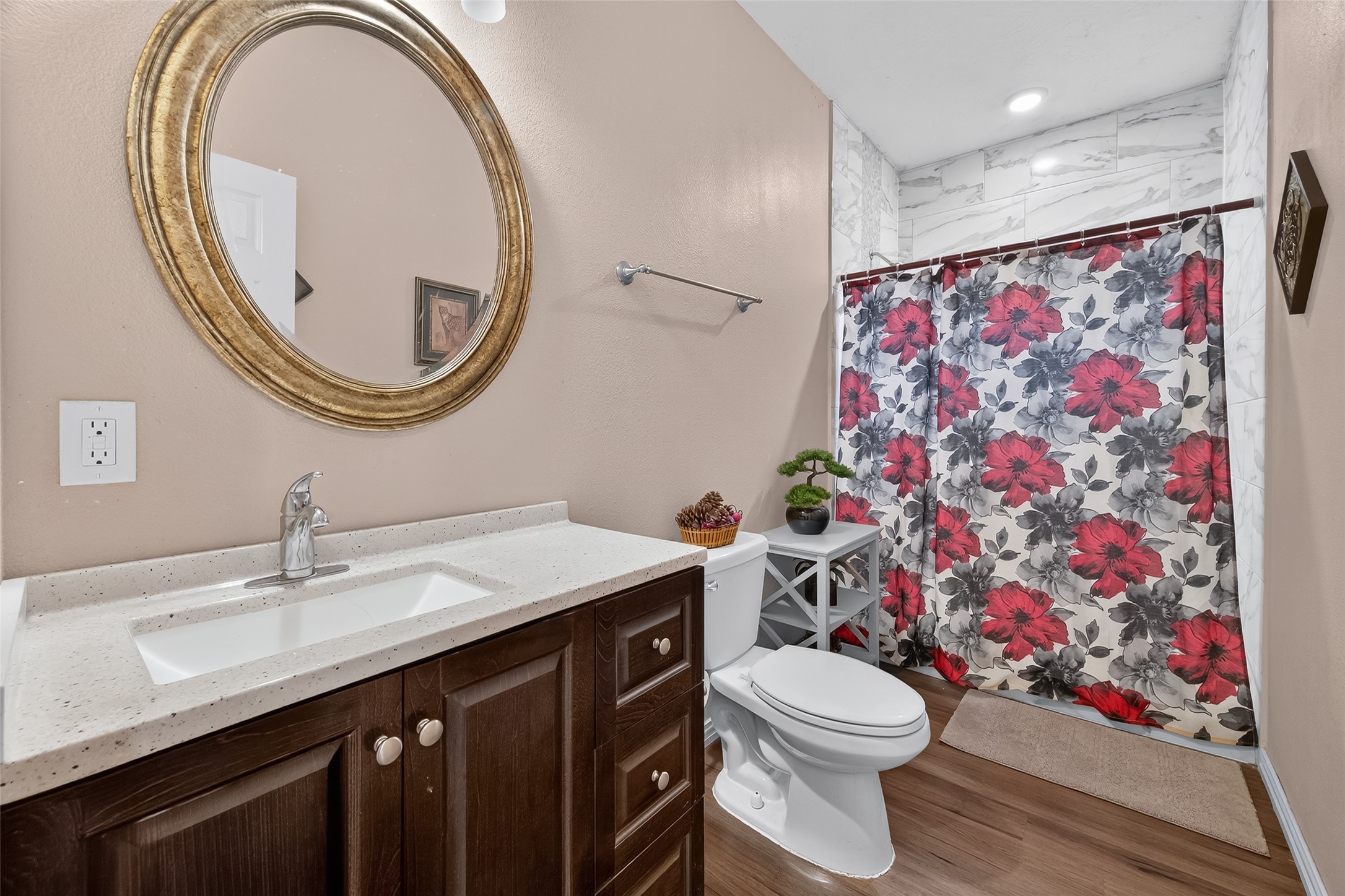 1619 Dolores Street Rosharon, TX 77583 - Photo 21 of 31 a bathroom with a sink a toilet and a mirror