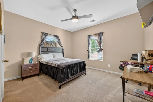 a bed room with a bed and a window