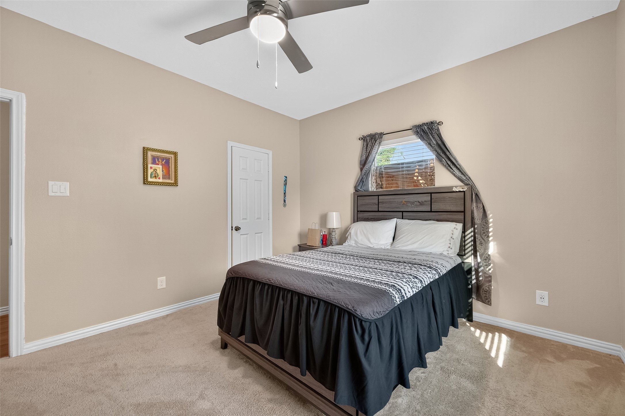 1619 Dolores Street Rosharon, TX 77583 - Photo 24 of 31 a bedroom with a bed and a chandelier