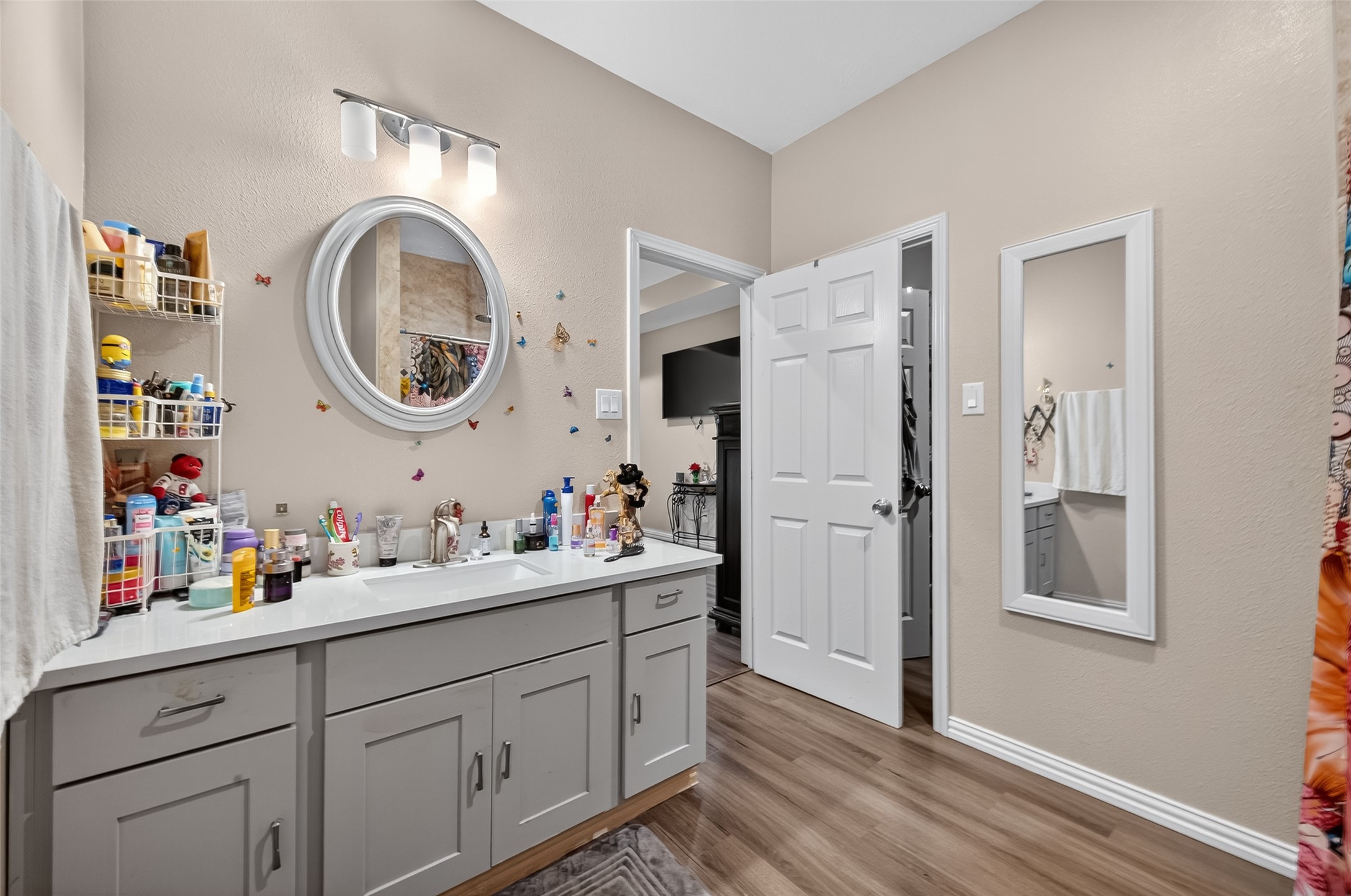 1619 Dolores Street Rosharon, TX 77583 - Photo 30 of 31 a kitchen with cabinets a sink and a refrigerator
