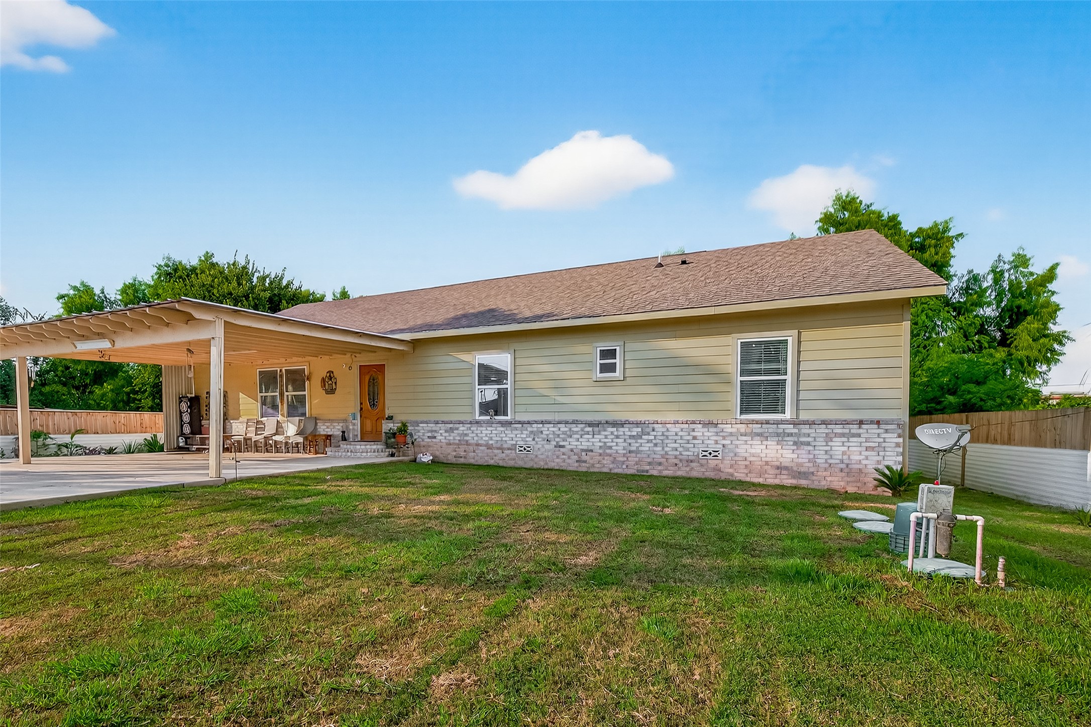 1619 Dolores Street Rosharon, TX 77583 - Photo 4 of 31 a view of a house with a yard and sitting area