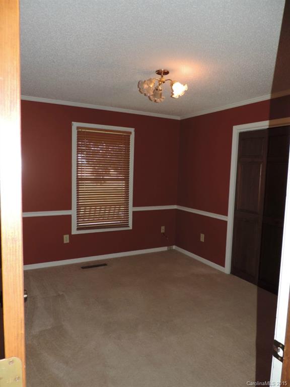 225 Woodridge Road Mooresville, NC 28115 - Photo 14 of 23 a view of an empty room with a window