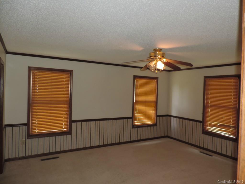 225 Woodridge Road Mooresville, NC 28115 - Photo 16 of 23 wooden floor in an empty room with a window
