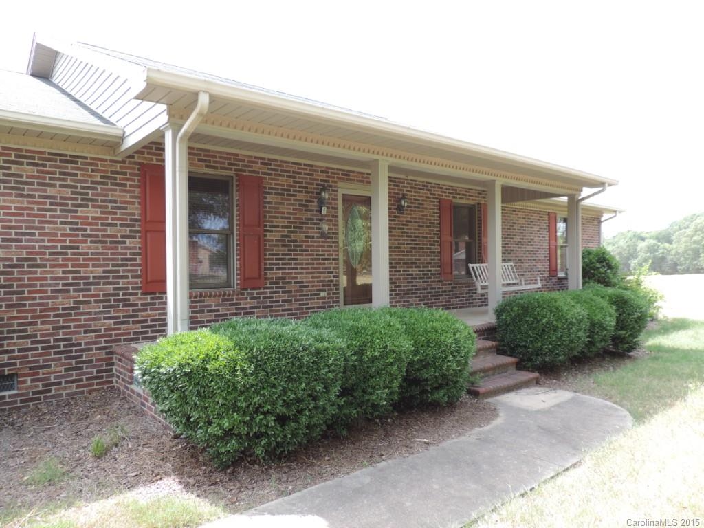 225 Woodridge Road Mooresville, NC 28115 - Photo 19 of 23 a front view of a house with garden