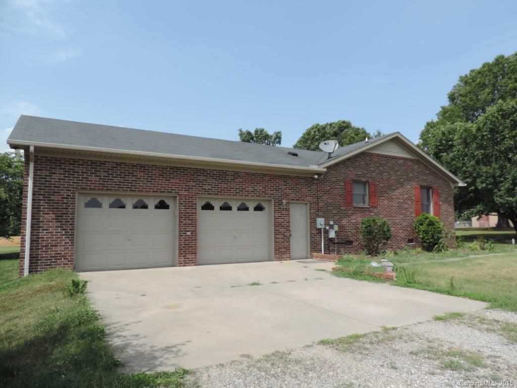 225 Woodridge Road Mooresville, NC 28115 - Photo 22 of 23 a front view of a house with a yard and garage