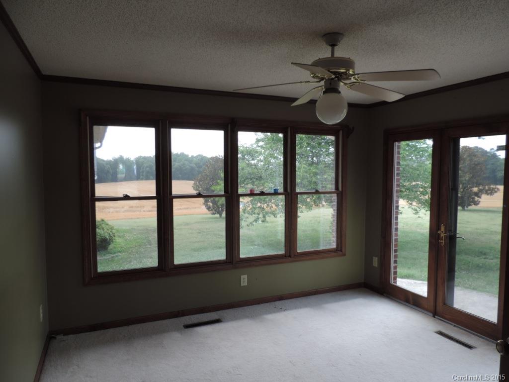 225 Woodridge Road Mooresville, NC 28115 - Photo 4 of 23 a view of an empty room with a window