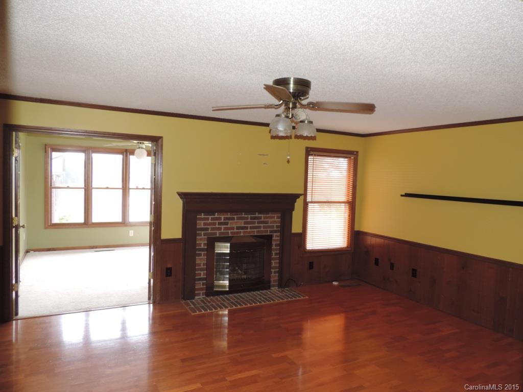 225 Woodridge Road Mooresville, NC 28115 - Photo 5 of 23 a living room with a fireplace