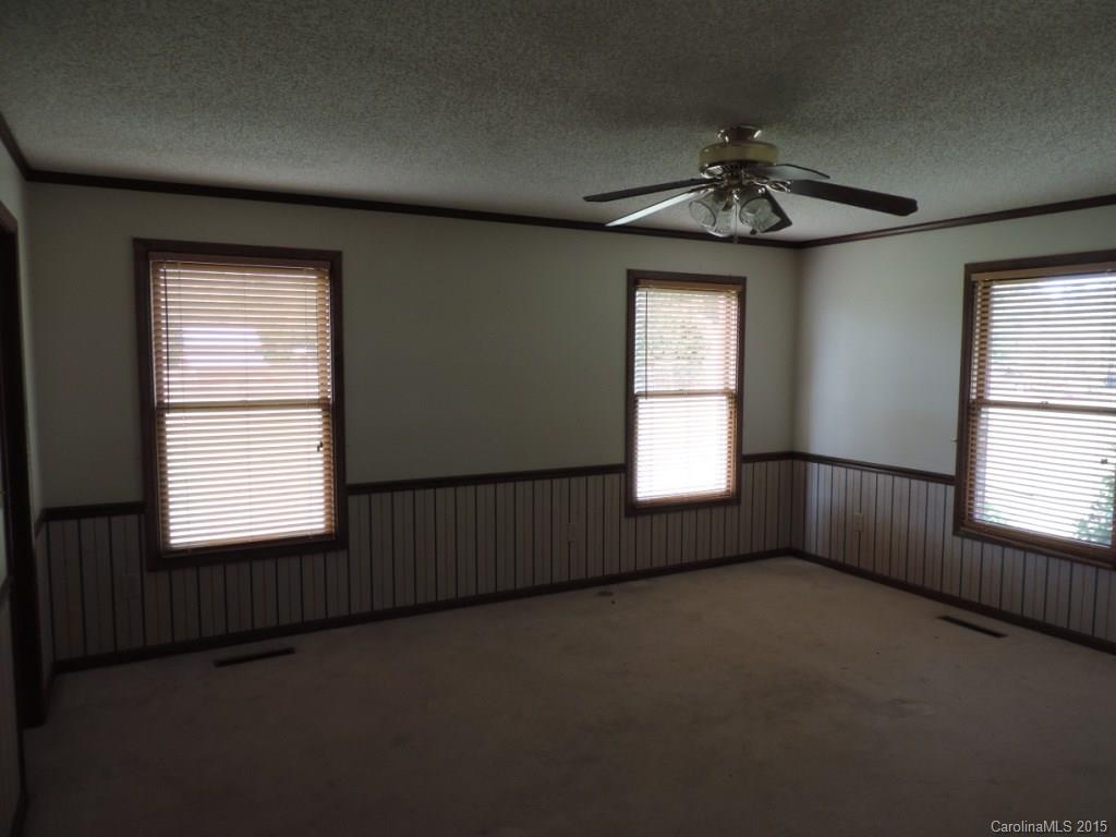225 Woodridge Road Mooresville, NC 28115 - Photo 6 of 23 a view of an empty room with a window