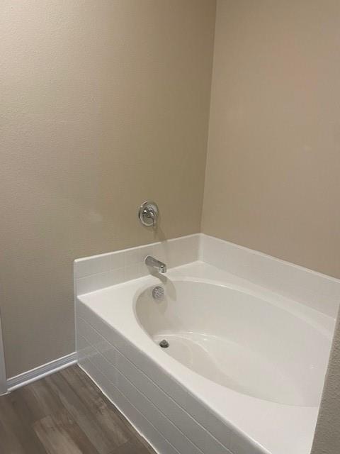 205 Lake Ridge Princeton, TX 75407 - Photo 10 of 13 Full bath with dark wood-style floors and a bath