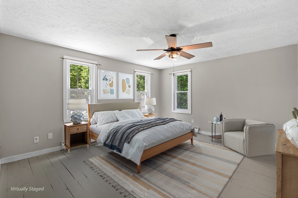 254 Adams Road Oakham, MA 01068 - Photo 11 of 29 a bedroom with a bed chandelier and a window