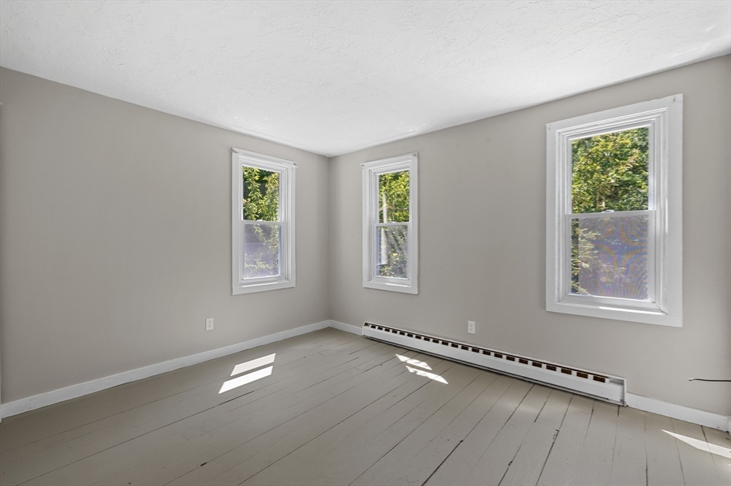 254 Adams Road Oakham, MA 01068 - Photo 16 of 29 a view of an empty room with a window
