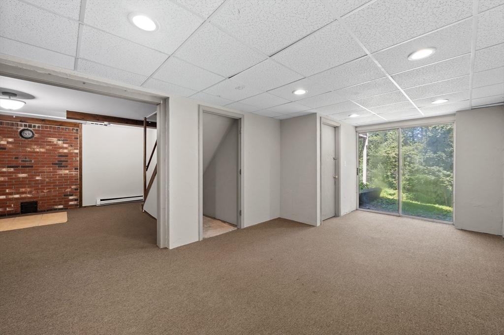 254 Adams Road Oakham, MA 01068 - Photo 21 of 29 a view of a livingroom with a staircase