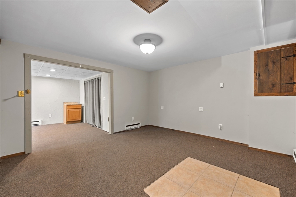 254 Adams Road Oakham, MA 01068 - Photo 23 of 29 an empty room with closet and cabinet