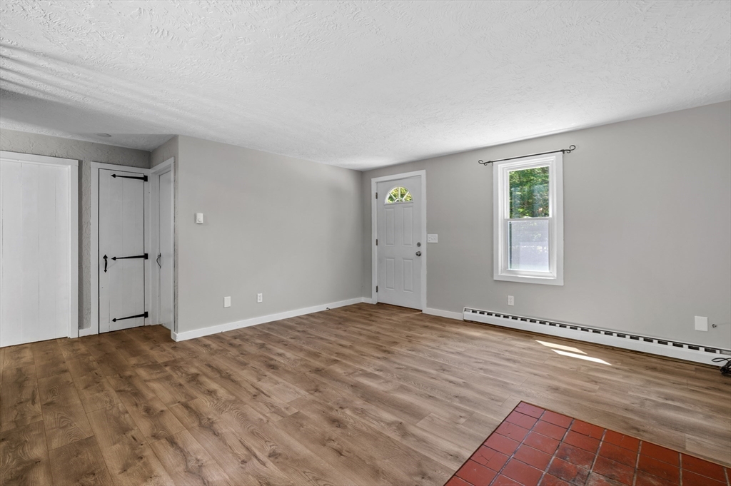 254 Adams Road Oakham, MA 01068 - Photo 5 of 29 a view of an empty room and window