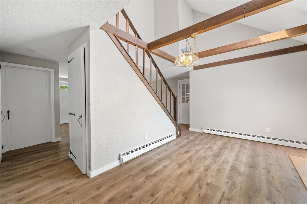254 Adams Road Oakham, MA 01068 - Photo 7 of 29 a view of an entryway with wooden floor