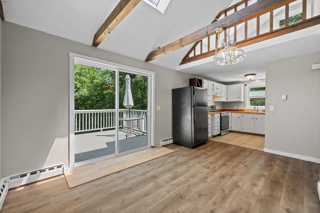 254 Adams Road Oakham, MA 01068 - Photo 8 of 29 a view of a hallway with a kitchen