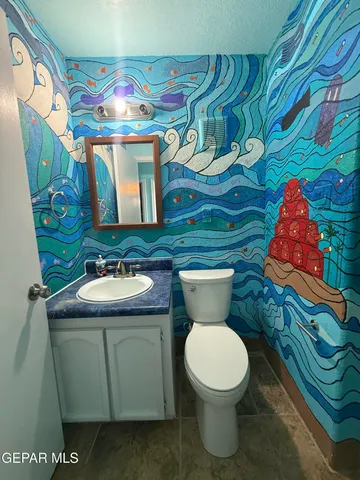 a bathroom with a toilet and bathtub