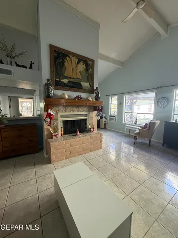 a bathroom with a granite countertop sink a toilet a mirror and shower