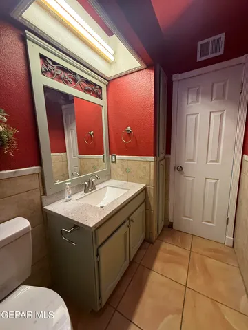 a kitchen with a stove a sink and a microwave