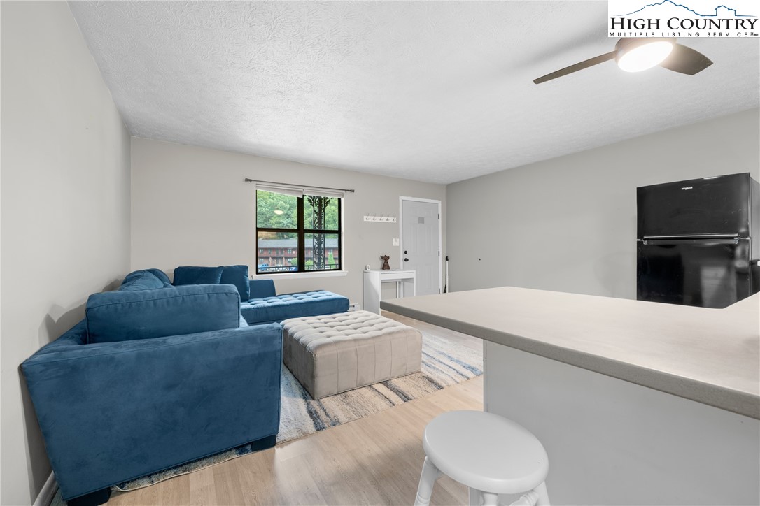 1469 West King Street, Unit 201 Boone, NC 28607 - Photo 11 of 19 a living room with furniture and a window