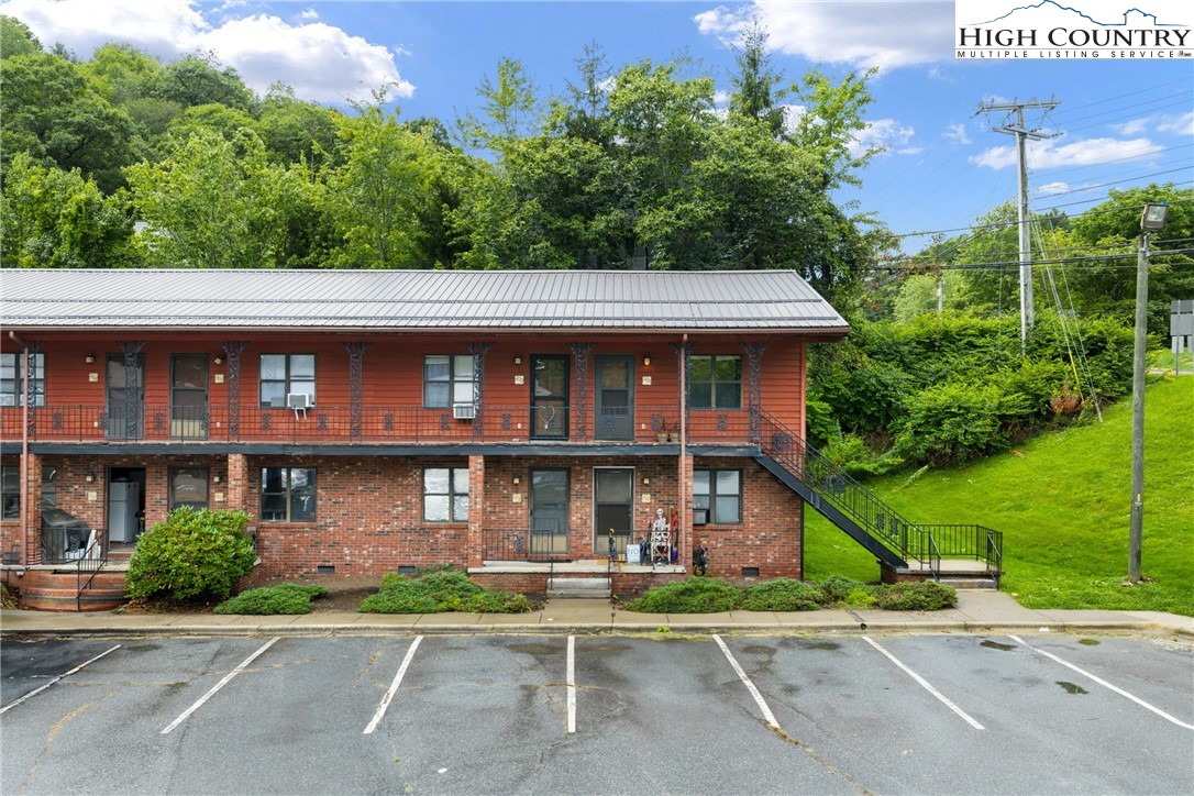 1469 West King Street, Unit 201 Boone, NC 28607 - Photo 18 of 19 a front view of a building with garden