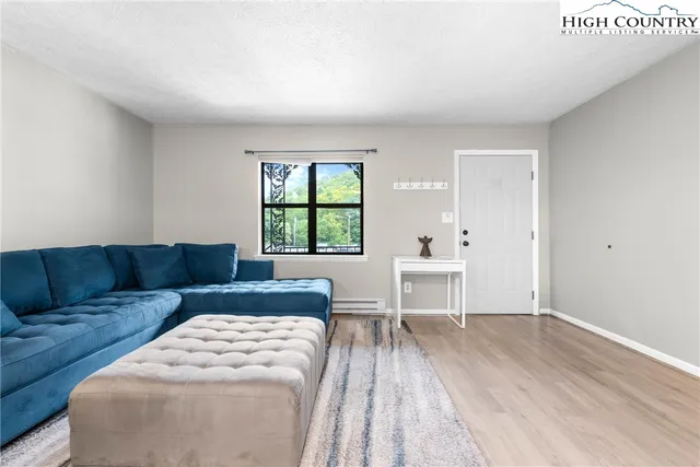 a living room with furniture and a window