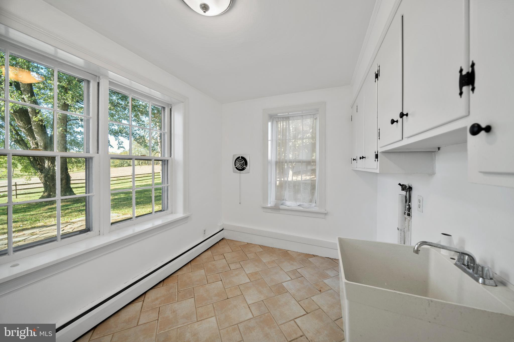 1025 North Chatham Road West Grove, PA 19390 - Photo 14 of 44 a bathroom with a tub sink and window