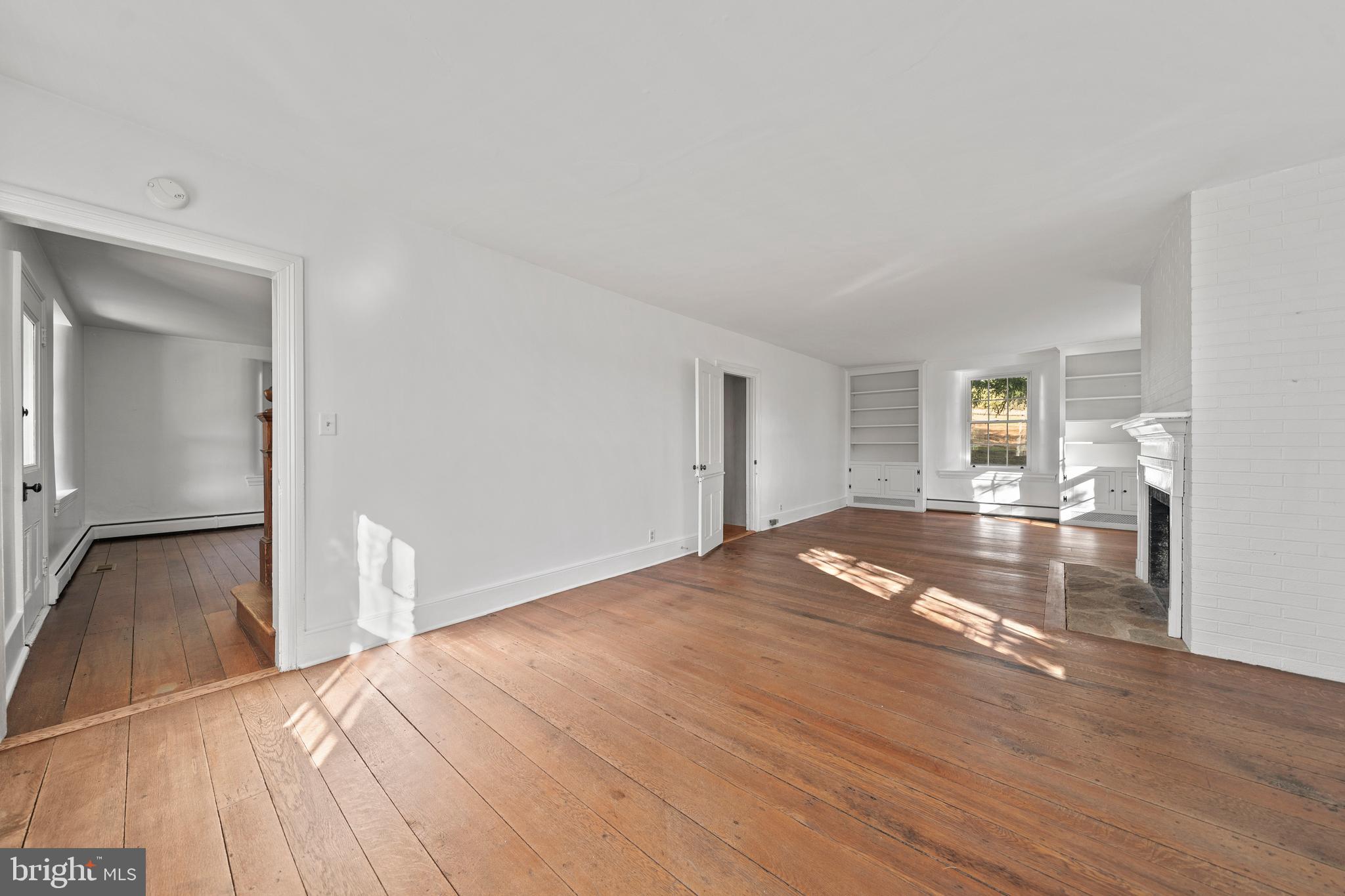 1025 North Chatham Road West Grove, PA 19390 - Photo 19 of 44 a view of a livingroom with wooden floor and a flat screen tv