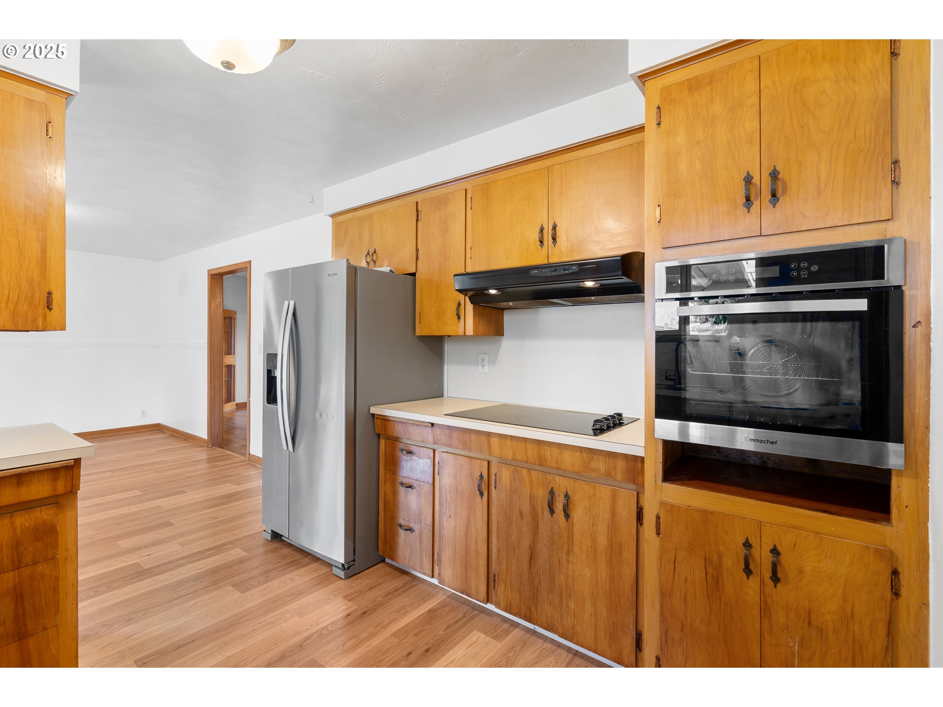 1897 Chelan Street Northeast Keizer, OR 97303 - Photo 12 of 39 a kitchen with stainless steel appliances a stove and a refrigerator