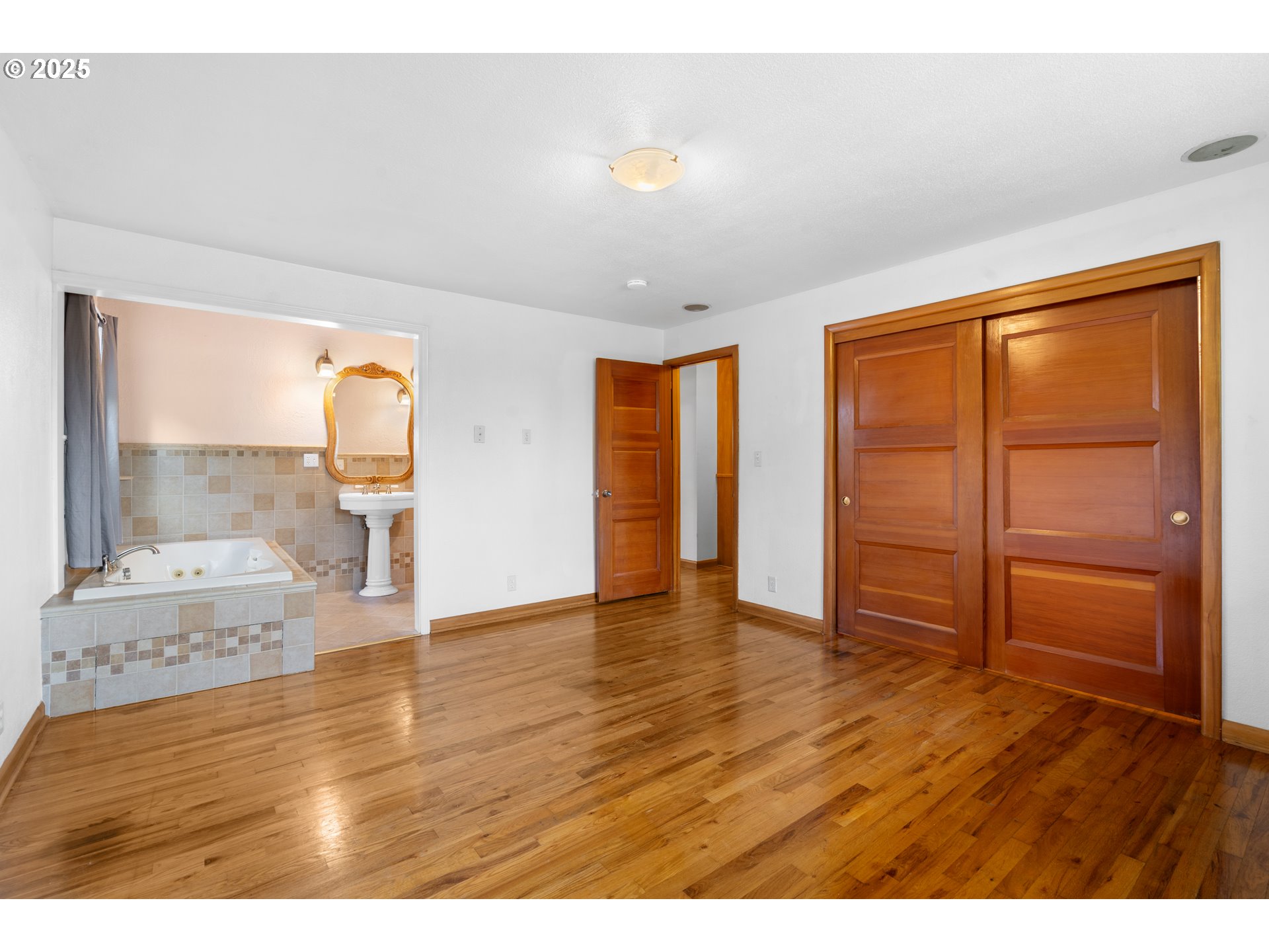 1897 Chelan Street Northeast Keizer, OR 97303 - Photo 16 of 39 a view of empty room with wooden floor and fan