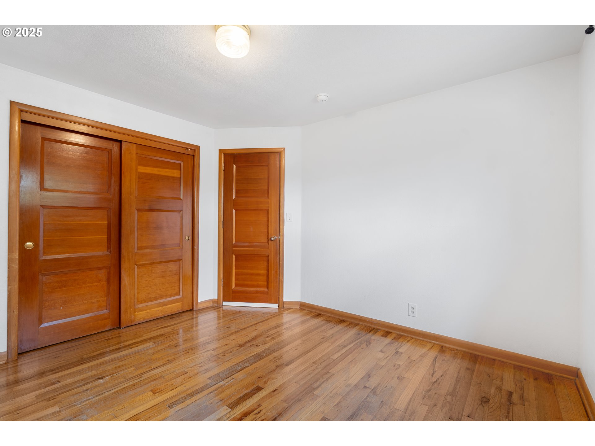 1897 Chelan Street Northeast Keizer, OR 97303 - Photo 22 of 39 a view of an empty room with wooden floor