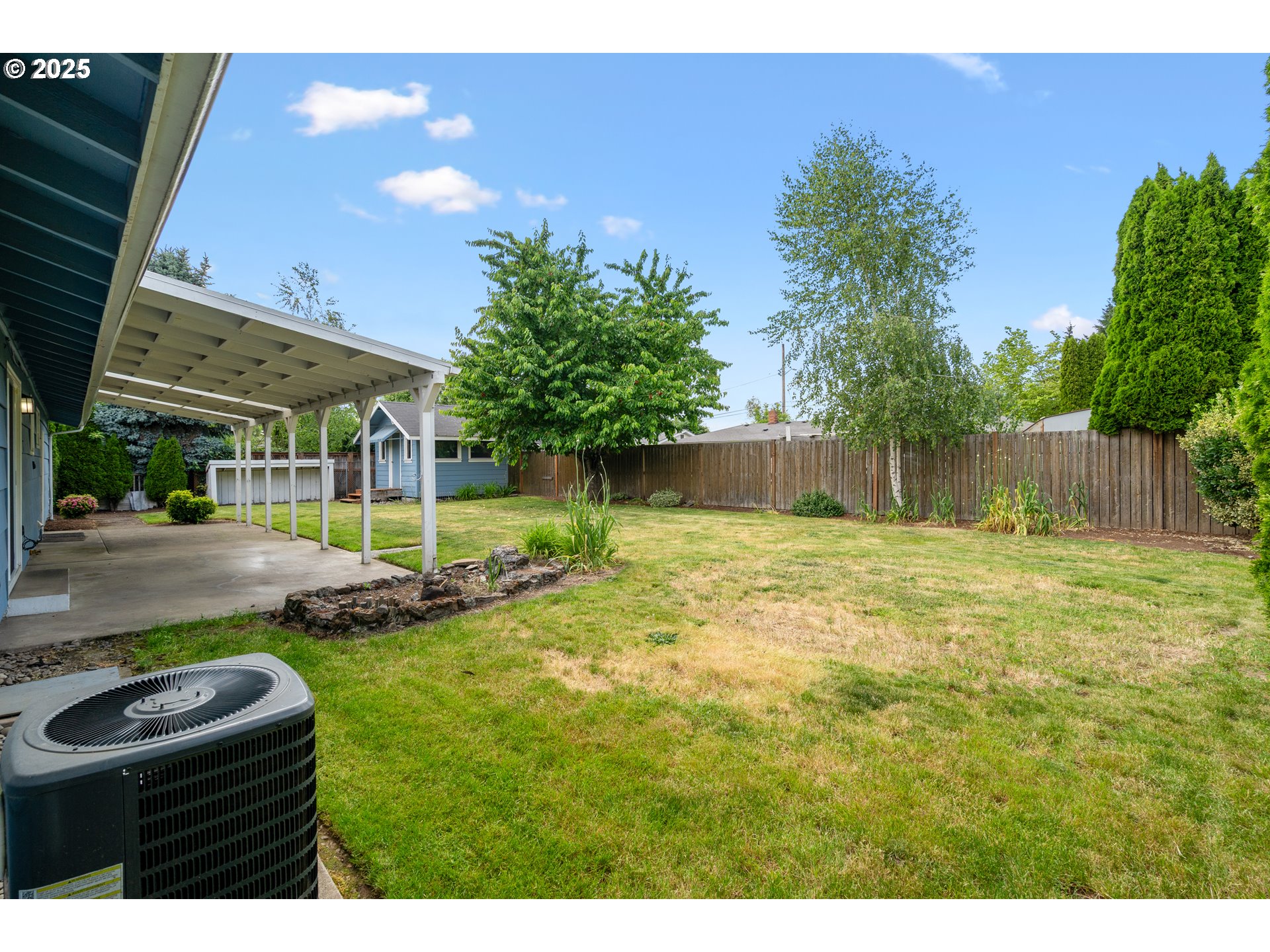 1897 Chelan Street Northeast Keizer, OR 97303 - Photo 27 of 39 a view of a backyard with plants and a patio