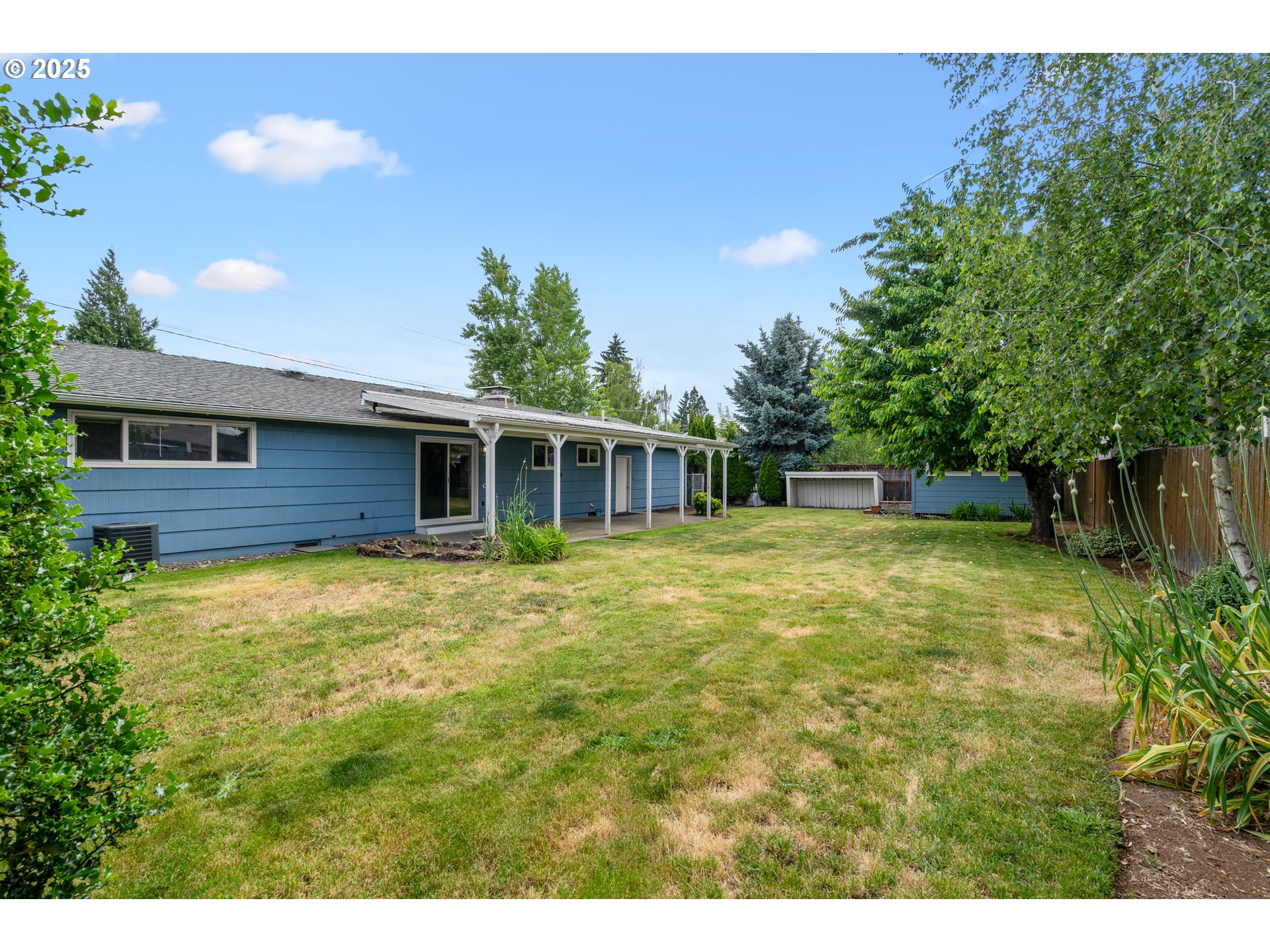 1897 Chelan Street Northeast Keizer, OR 97303 - Photo 28 of 39 a front view of a house with a garden