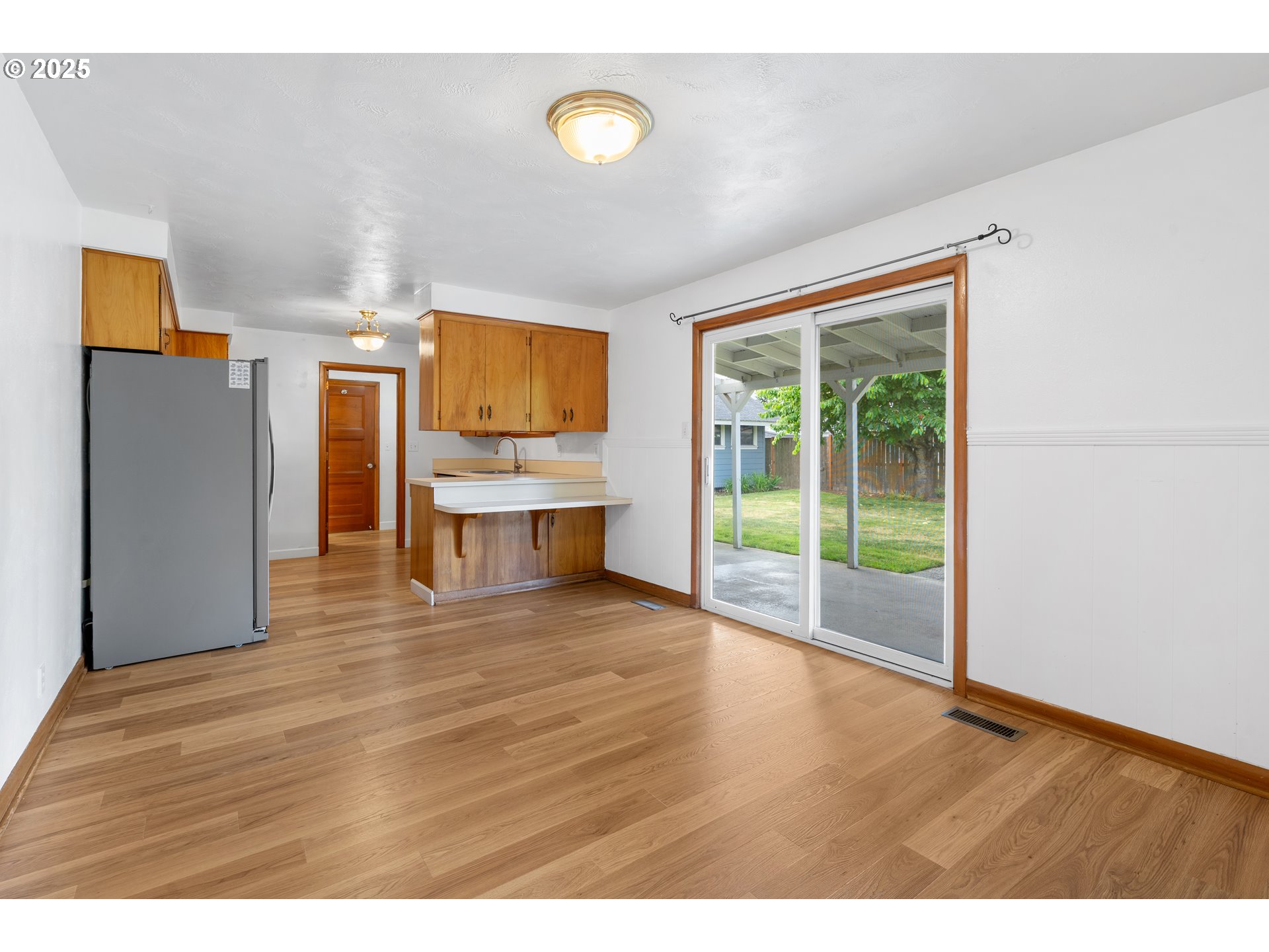 1897 Chelan Street Northeast Keizer, OR 97303 - Photo 7 of 39 a view of a kitchen with a fridge