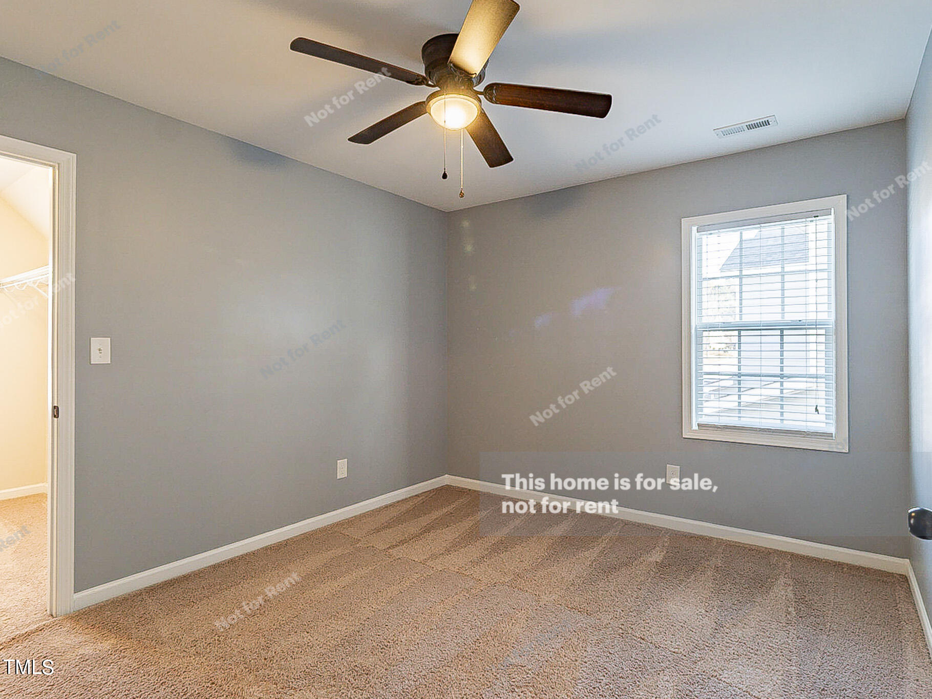 191 Verrazano Place Clayton, NC 27520 - Photo 18 of 28 an empty room with a window and a fan