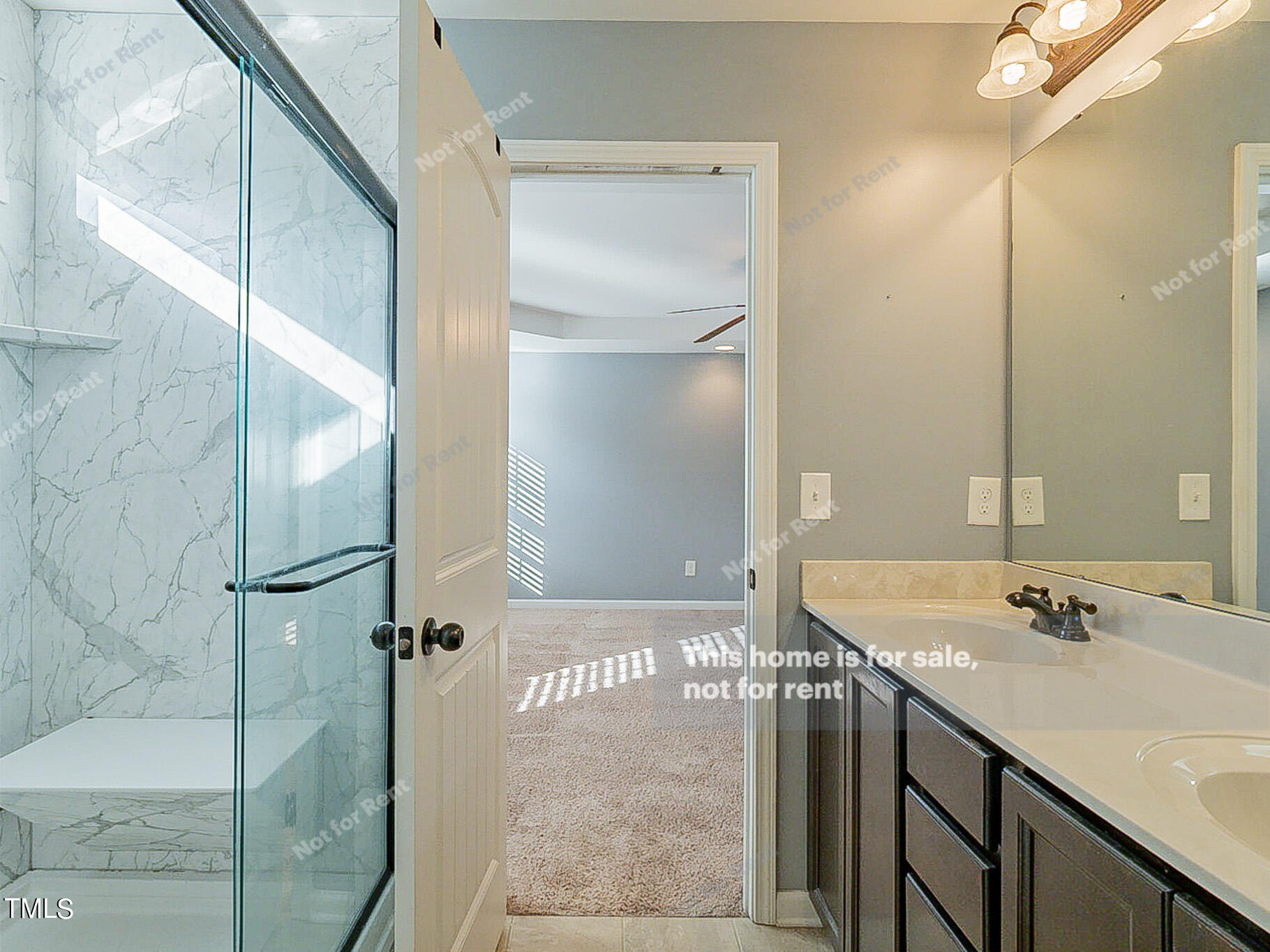 191 Verrazano Place Clayton, NC 27520 - Photo 20 of 28 a bathroom with a shower sink and mirror