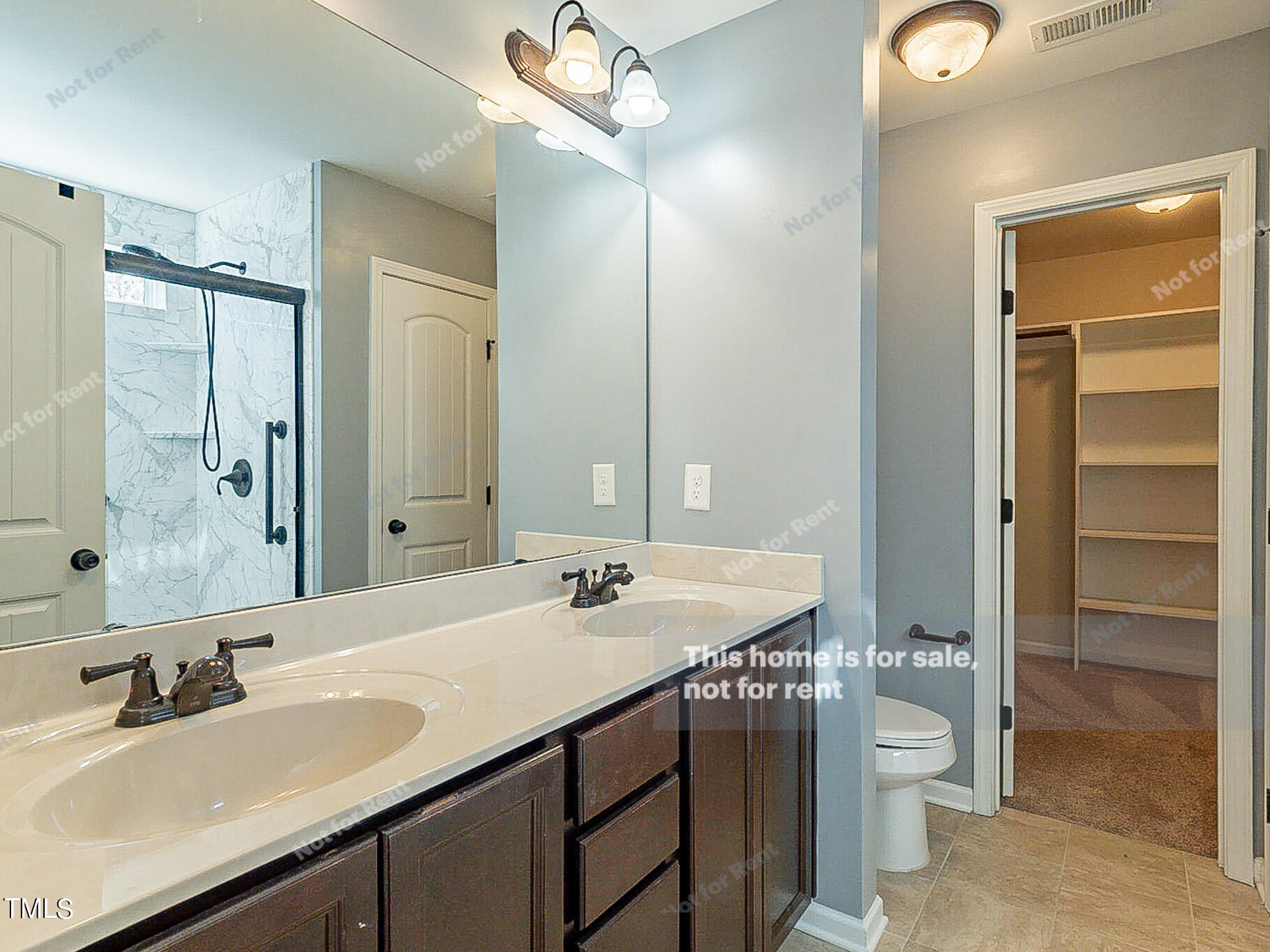 191 Verrazano Place Clayton, NC 27520 - Photo 21 of 28 a bathroom with a sink and a mirror