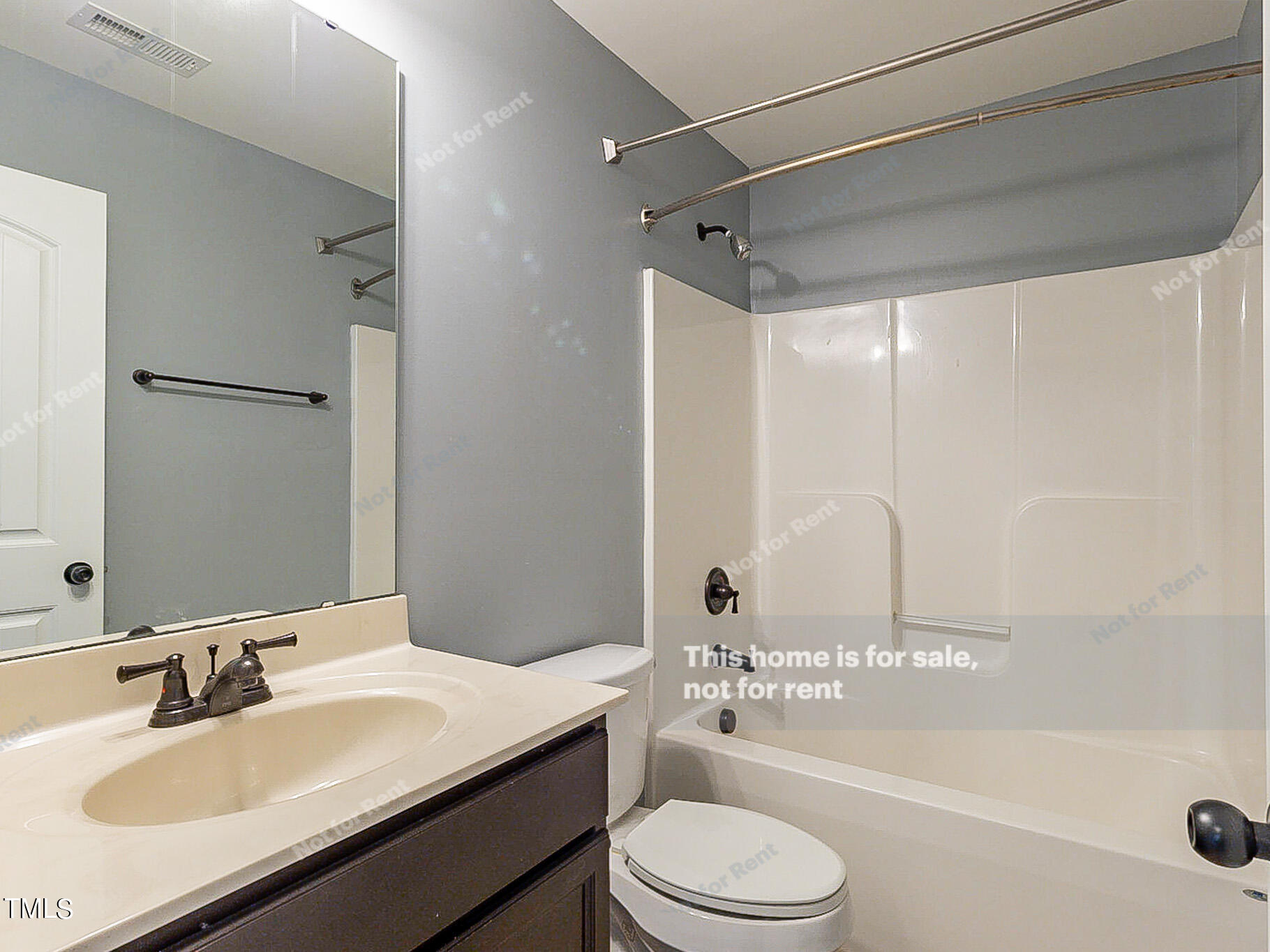 191 Verrazano Place Clayton, NC 27520 - Photo 22 of 28 a bathroom with a sink a toilet and a bathtub