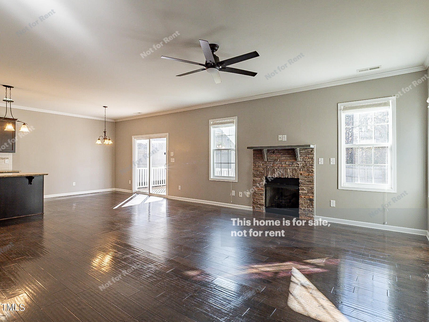 191 Verrazano Place Clayton, NC 27520 - Photo 4 of 28 a living room with hard wood floors and a fireplace