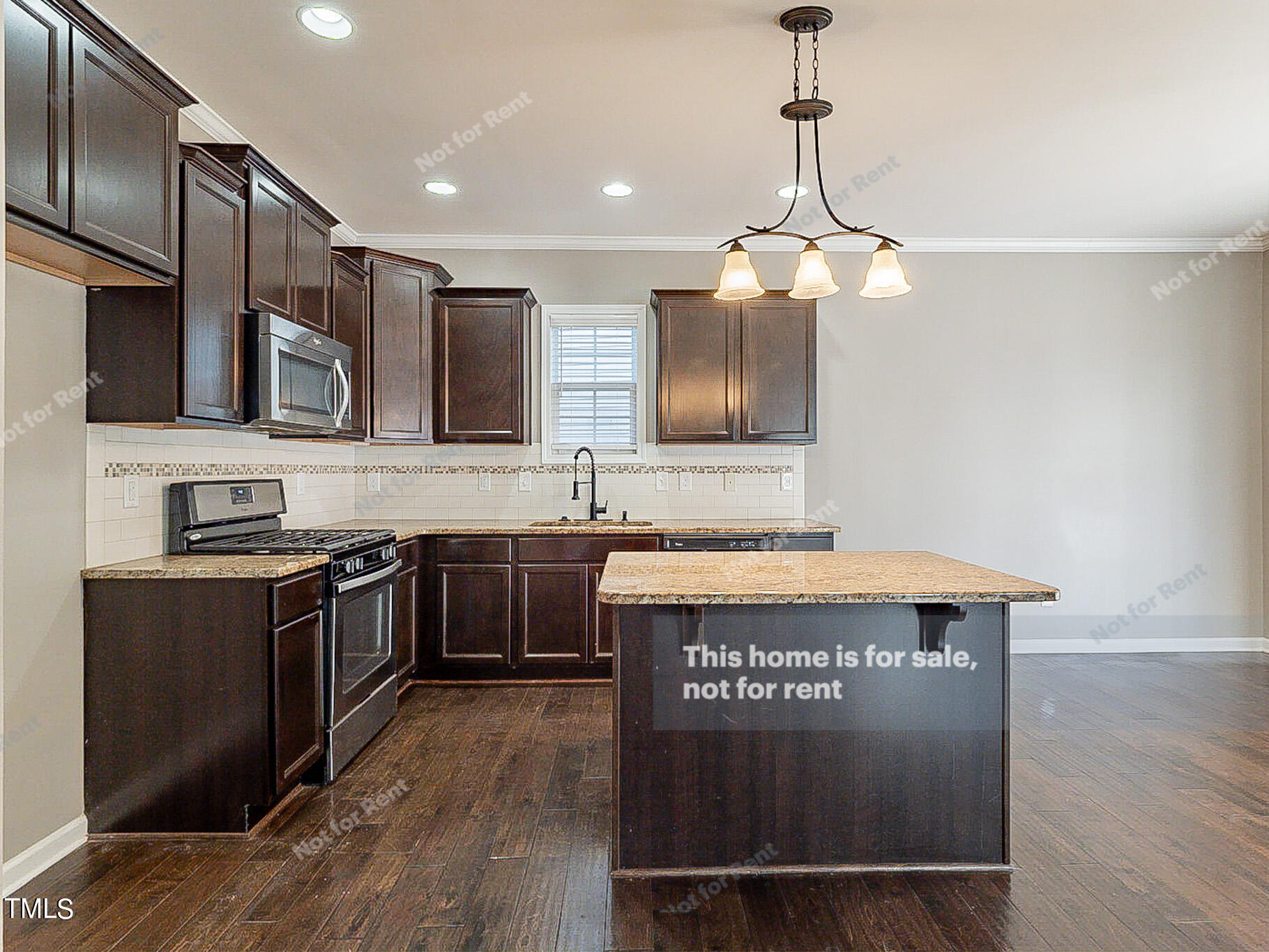 191 Verrazano Place Clayton, NC 27520 - Photo 7 of 28 a kitchen with stainless steel appliances granite countertop a stove and a sink