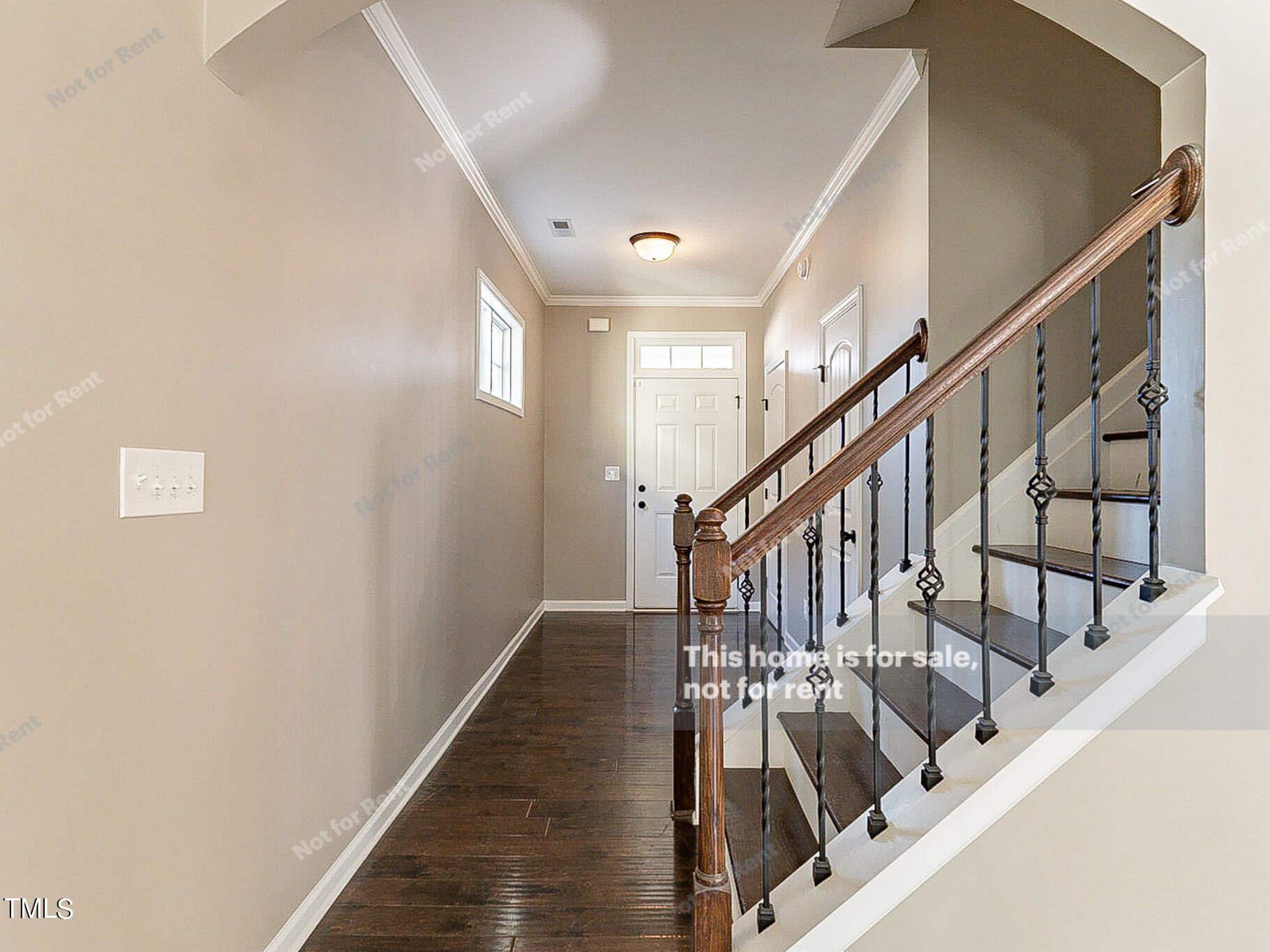 191 Verrazano Place Clayton, NC 27520 - Photo 10 of 28 a view of staircase with lots of frames on wall and wooden floor