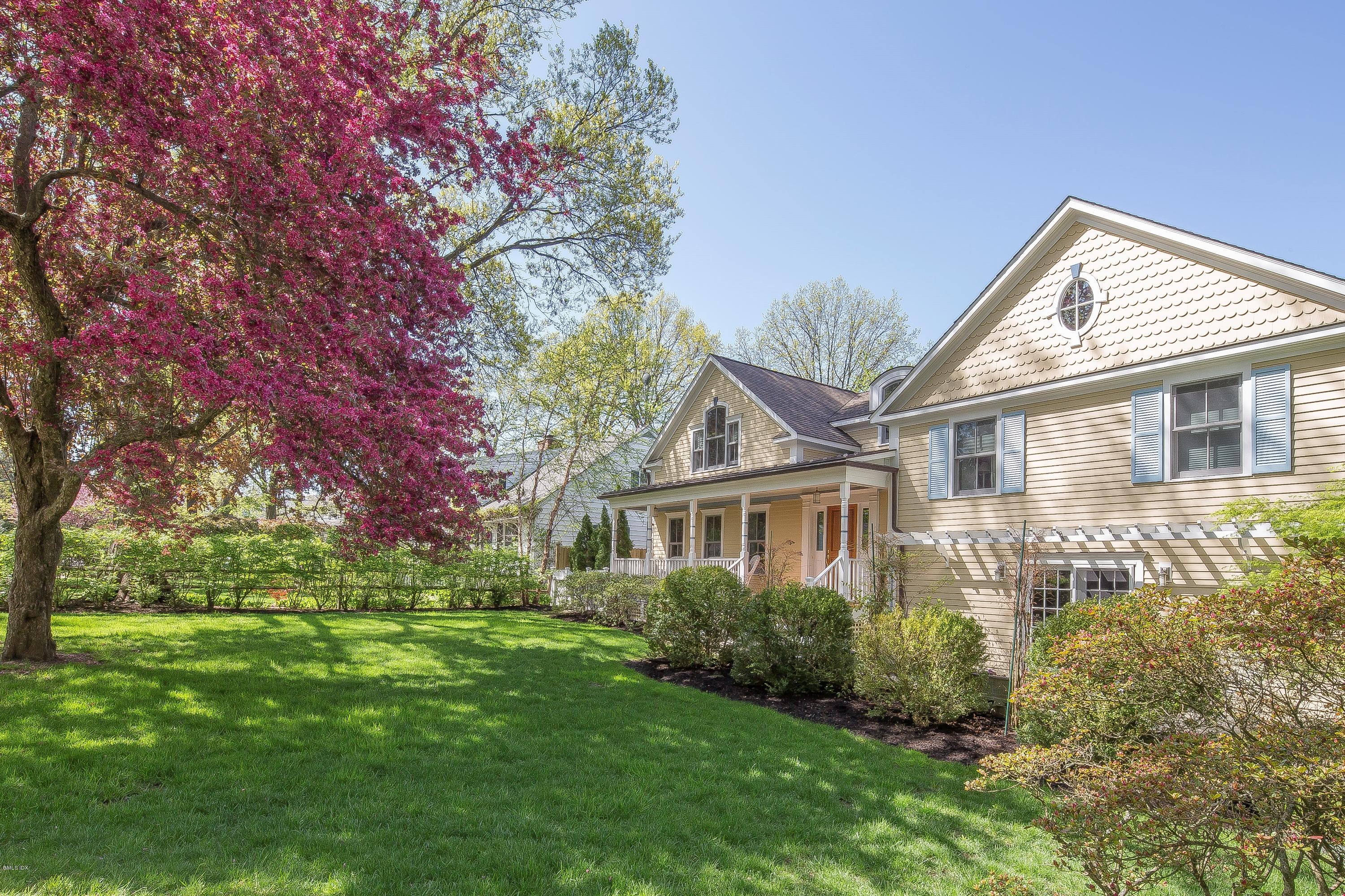 10 Palmer Terrace Riverside, CT 06878 - Photo 1 of 21 a front view of a house with a garden