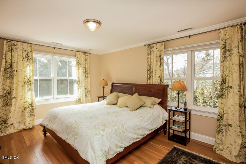 10 Palmer Terrace Riverside, CT 06878 - Photo 11 of 21 a bedroom with a bed and a large window