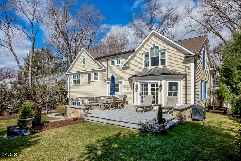 10 Palmer Terrace Riverside, CT 06878 - Photo 17 of 21 a front view of a house with a yard table and chairs
