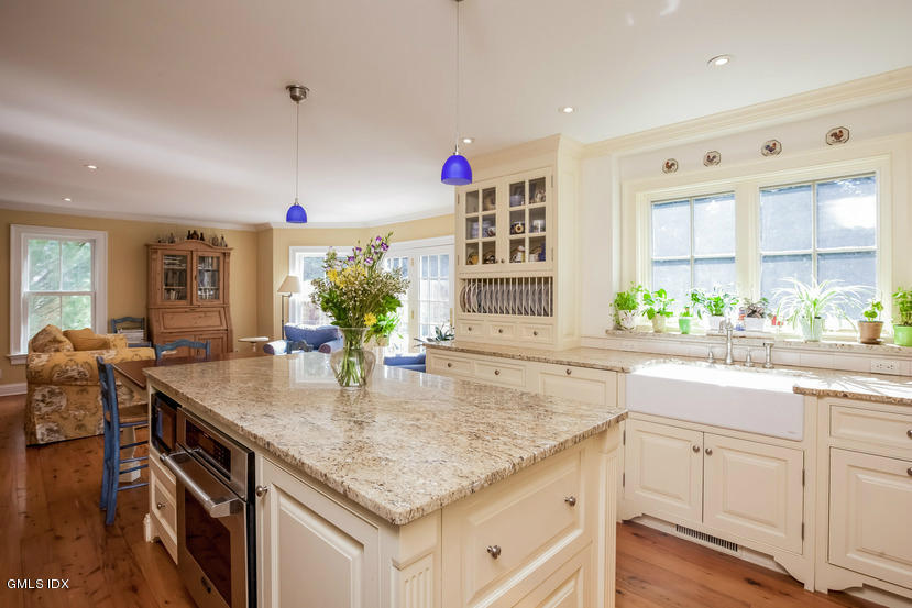 10 Palmer Terrace Riverside, CT 06878 - Photo 8 of 21 a kitchen with stainless steel appliances granite countertop a kitchen island a stove and a sink