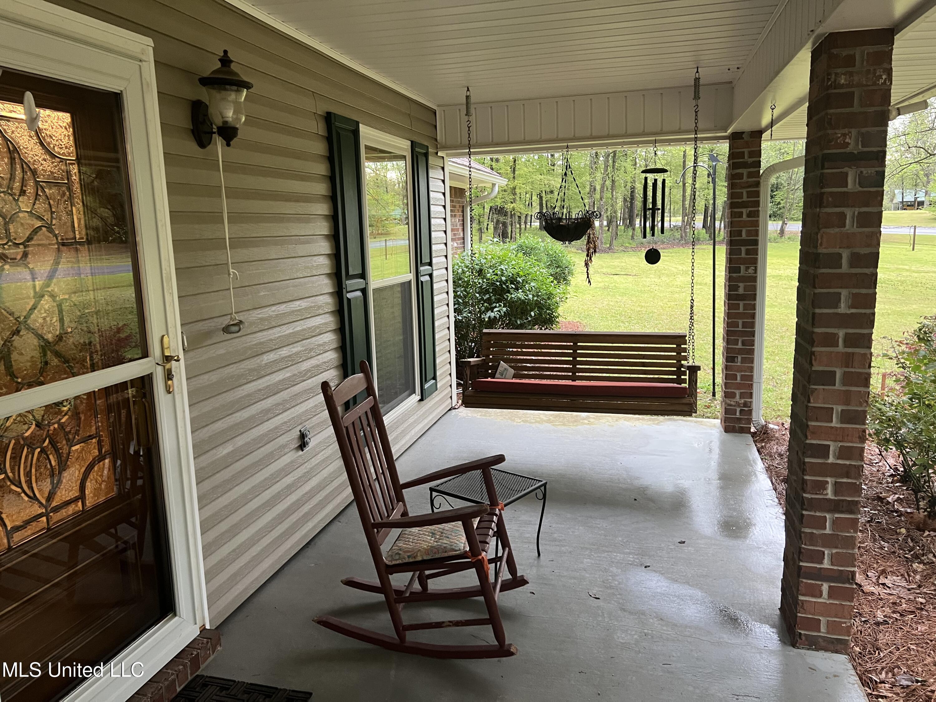 1031 Rocky Point Road Carthage, MS 39051 - Photo 4 of 19 IMG_1211.jpgRockyPointfrontporchswing